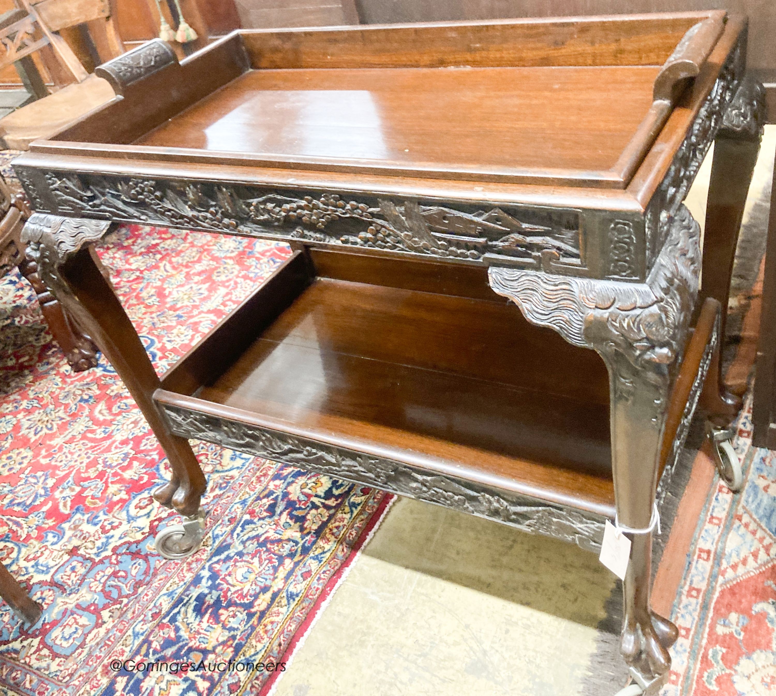 A Chinese carved hardwood tea trolley, with removable tray, width 80cm, depth 50cm, height 75cm